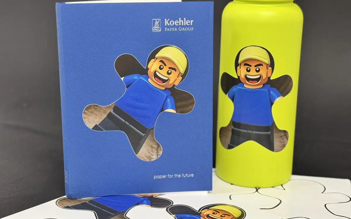 Sticker sample sheets, notebook, and bottle with matching character graphic